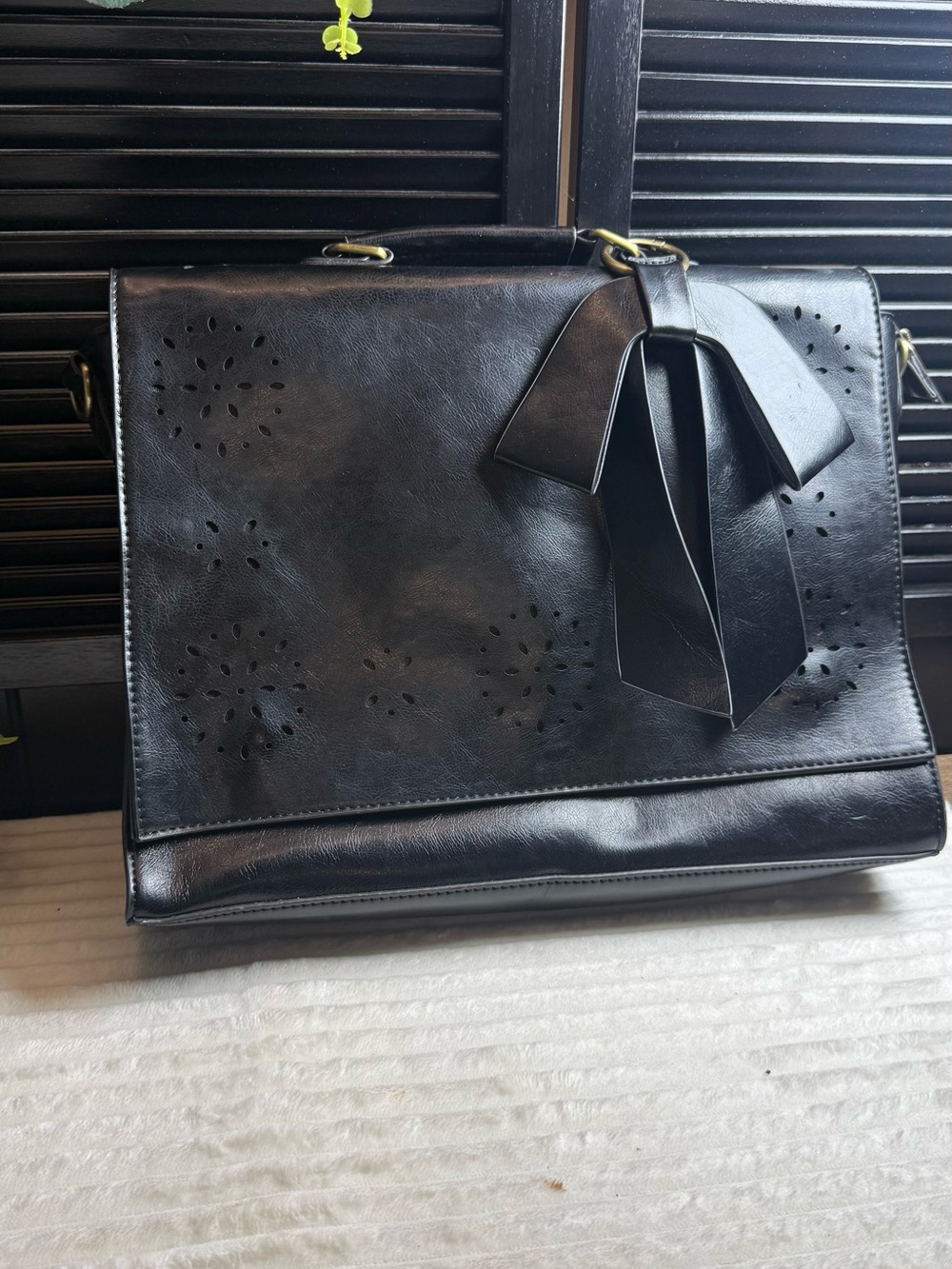 Elegant Black Satchel with Decorative Bow Accent